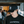 Load image into Gallery viewer, A man with a mustache wearing a Press Coffee dad hat featuring a hat with patch that includes cactus, a desert mountain range, and a beaming sun.