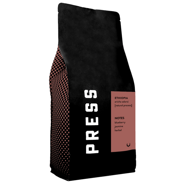 Ethiopia Aricha Adorsi single origin coffee by Press Coffee Roasters
Ethiopia Aricha Adorsi single origin coffee information (for the black and white image w/ text)
Side profile view of Ethiopia Aricha Adorsi single origin coffee by Press Coffee Roasters
