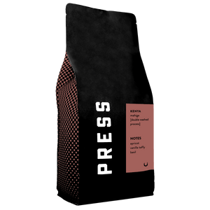 Black coffee bag with 'PRESS' branding and coffee type information on a white background
