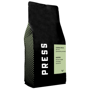 Coffee bag with 'PRESS' branding and coffee type information on a white background