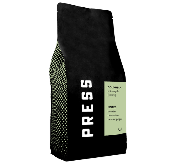 Colombia el triangulo natural process coffee by Press Coffee. Featuring notes of lavender, clementine, and candied ginger. 