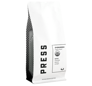 Evergreen Organic Coffee Blend by Press Coffee Roasters. Featuring notes of chocolate, almond, and orange. 