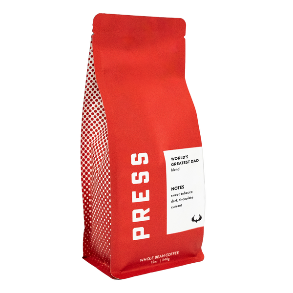 Red coffee bag with 'PRESS' branding and a label on a white background